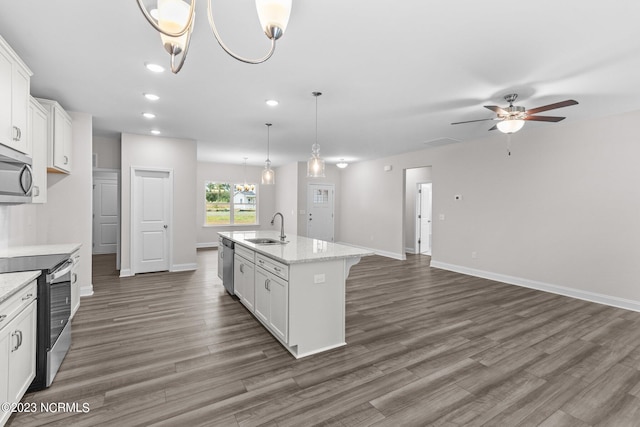 kitchen with a center island with sink, sink, white cabinets, and stainless steel appliances