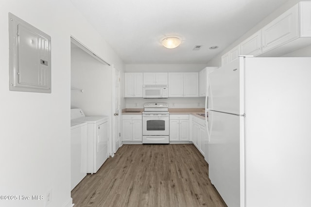 kitchen featuring white appliances, washer and clothes dryer, light hardwood / wood-style flooring, white cabinetry, and electric panel