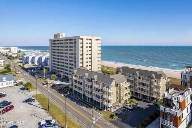 drone / aerial view featuring a view of the beach and a water view