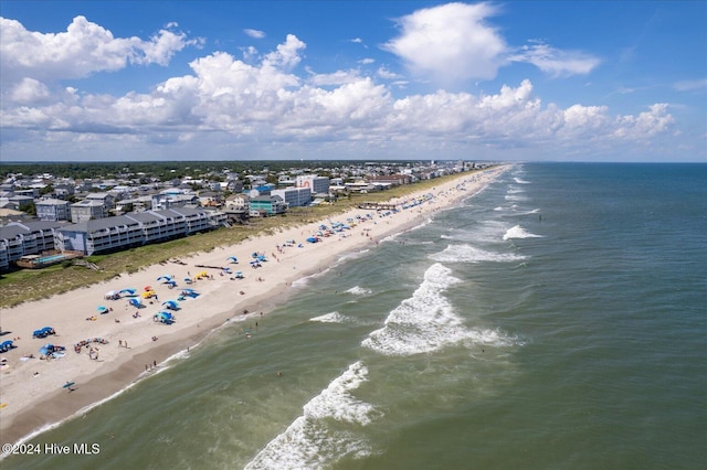 bird's eye view with a water view and a view of the beach