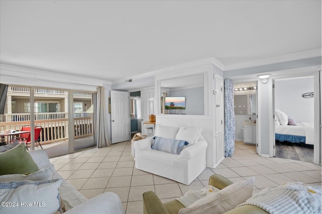 living room with light tile patterned floors and ornamental molding