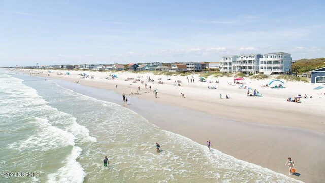 property view of water featuring a beach view