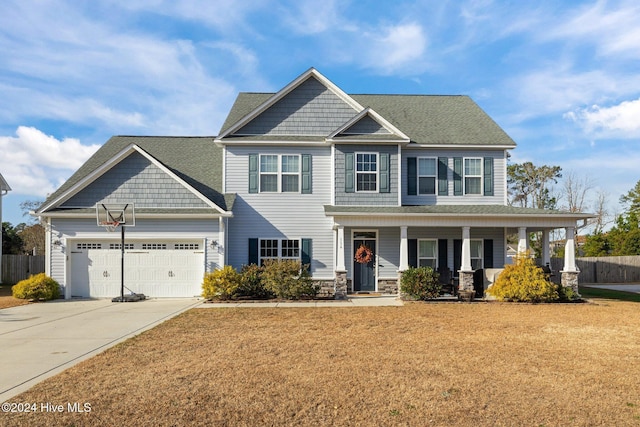 craftsman-style home featuring a front lawn and covered porch