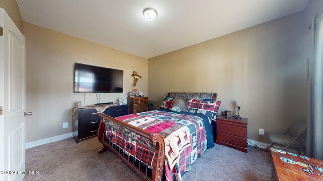 playroom featuring wood finished floors, a bar, wainscoting, crown molding, and a decorative wall