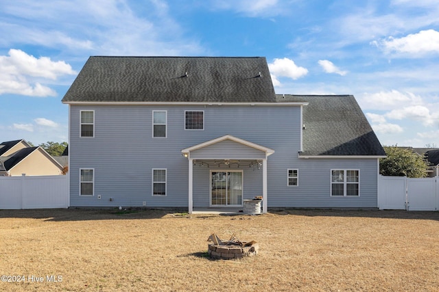 craftsman-style home featuring a front lawn, driveway, a porch, fence, and a garage