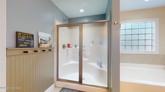 bathroom with a garden tub