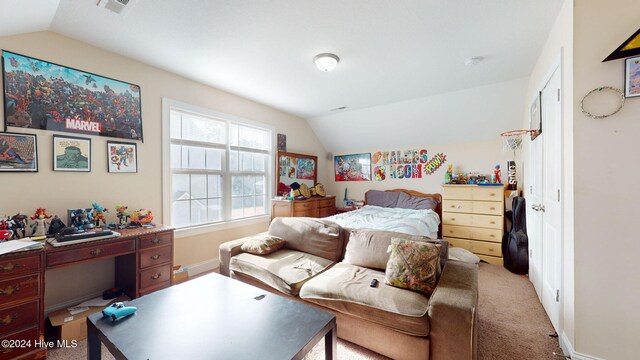 bedroom with visible vents, carpet floors, a textured ceiling, and baseboards