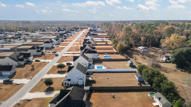 birds eye view of property with a residential view