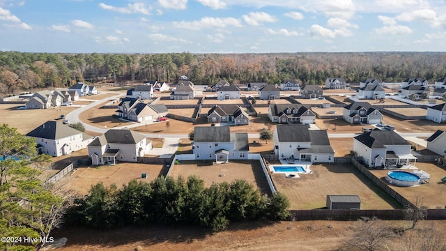 aerial view featuring a residential view and a view of trees