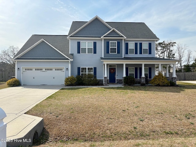 view of front of house featuring fence, concrete driveway, a front yard, covered porch, and an attached garage