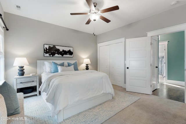 bedroom with carpet flooring, ceiling fan, and a closet