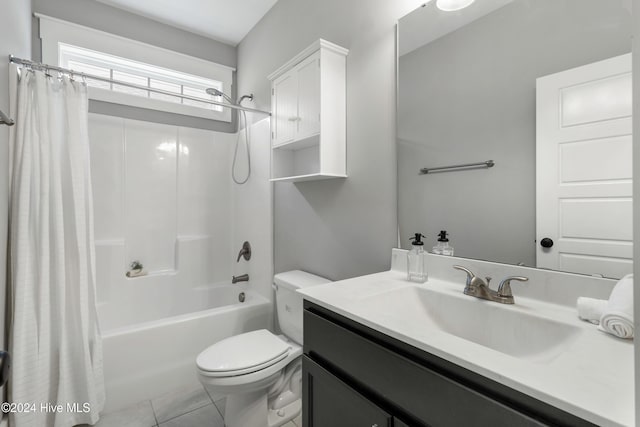 full bathroom with tile patterned floors, vanity, shower / bath combo, and toilet