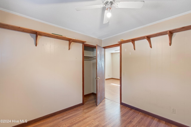 unfurnished bedroom featuring a ceiling fan, baseboards, light wood finished floors, and ornamental molding