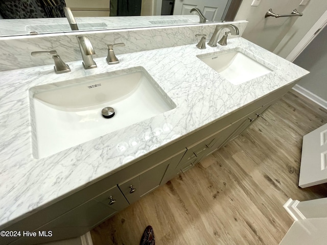 bathroom featuring hardwood / wood-style floors and vanity