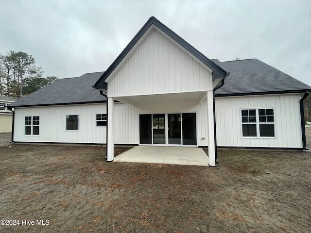 back of house with a patio