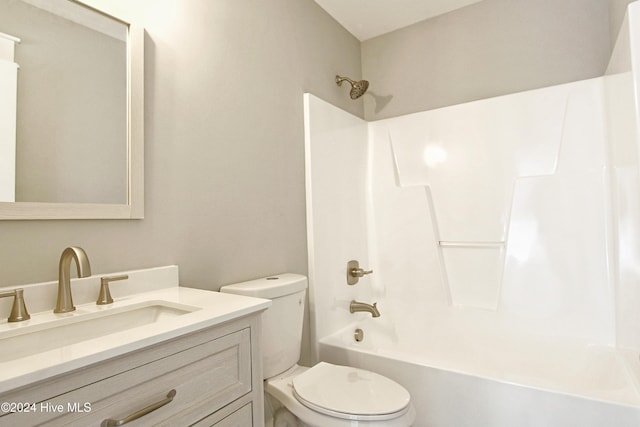 full bathroom featuring shower / tub combination, vanity, and toilet