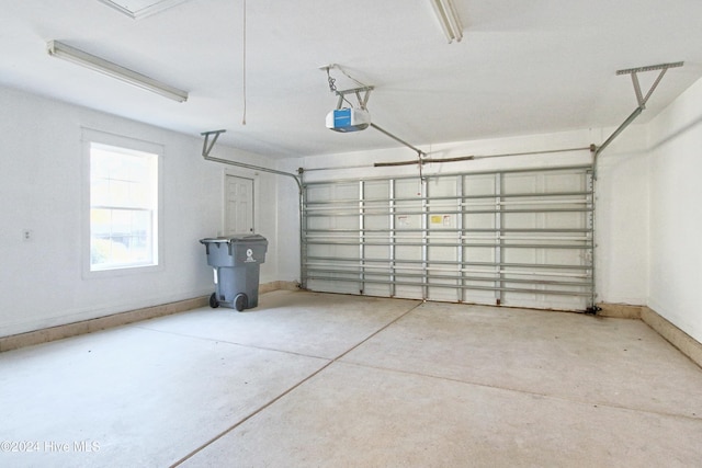 garage featuring a garage door opener