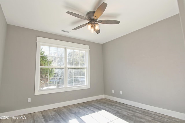 unfurnished room with ceiling fan and wood-type flooring