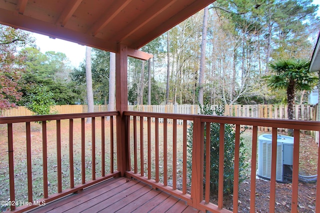 wooden deck featuring central AC unit