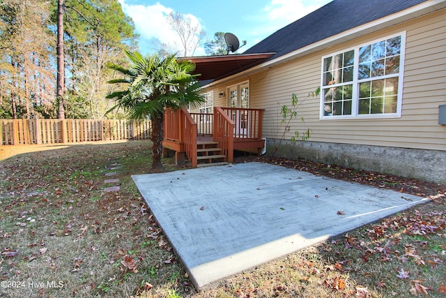 wooden terrace with a patio