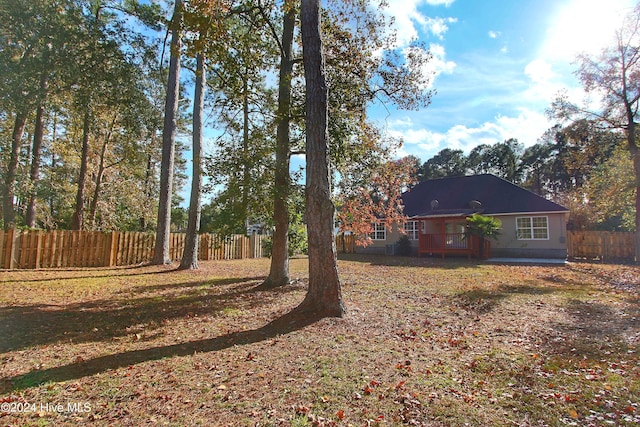 view of yard featuring a wooden deck