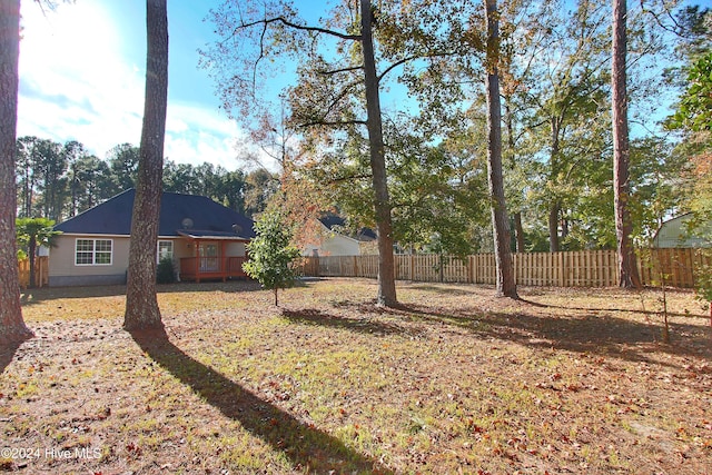 view of yard featuring a wooden deck