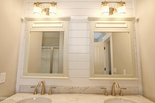 bathroom featuring vanity and an enclosed shower