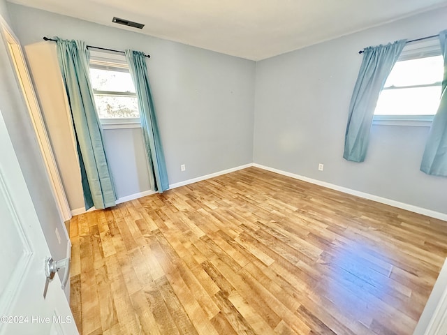 spare room with light wood-type flooring