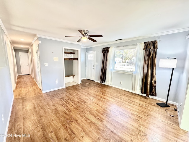 unfurnished bedroom featuring ceiling fan, ornamental molding, and light hardwood / wood-style flooring