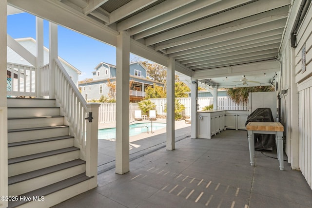view of patio / terrace featuring stairs, a fenced in pool, and a fenced backyard