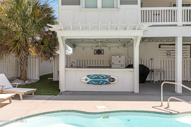 pool with a sink and fence