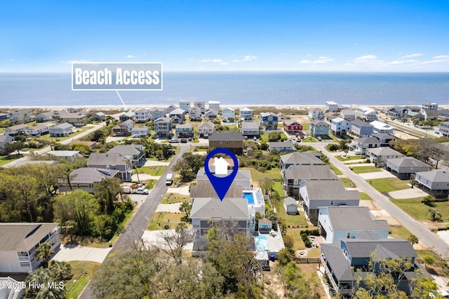 bird's eye view with a residential view and a water view