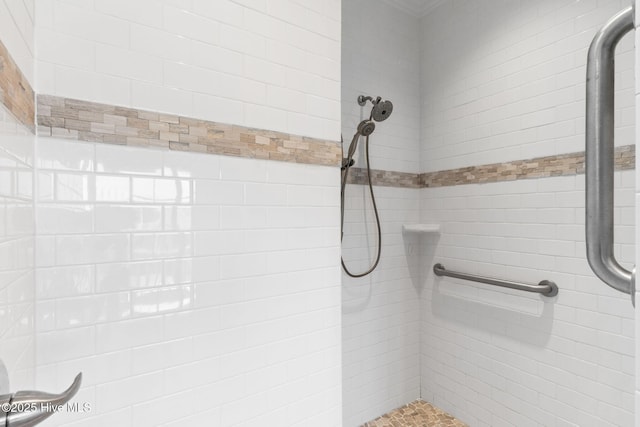 full bathroom with a tile shower