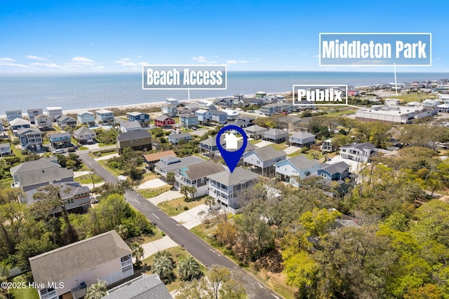 drone / aerial view with a water view and a residential view