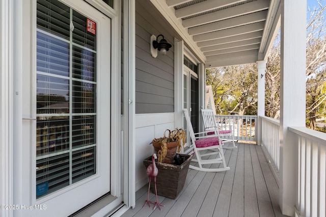 wooden terrace with a porch