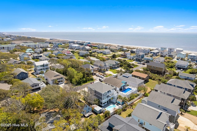 drone / aerial view with a residential view and a water view