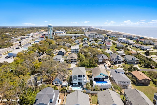 bird's eye view featuring a water view and a residential view