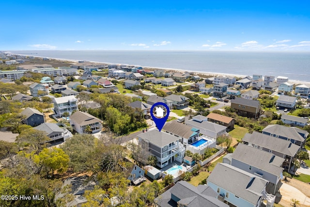 drone / aerial view with a residential view and a water view