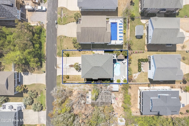 birds eye view of property with a residential view