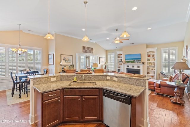 kitchen featuring a wealth of natural light, dishwasher, and wood-type flooring