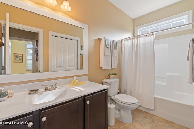 full bathroom with toilet, vanity, shower / tub combo with curtain, and a healthy amount of sunlight