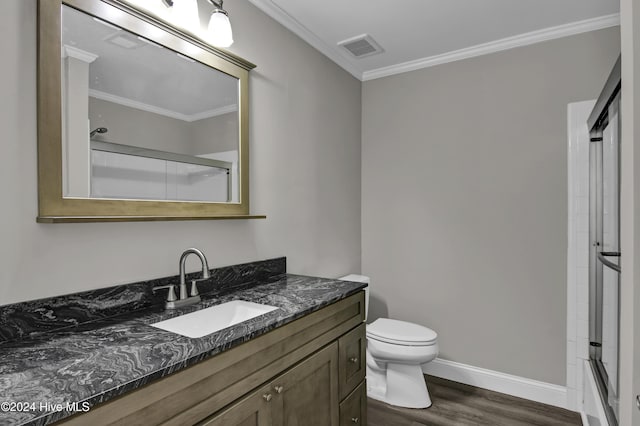 full bathroom with vanity, hardwood / wood-style flooring, toilet, and crown molding