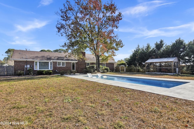 view of pool featuring a gazebo, a lawn, and a patio