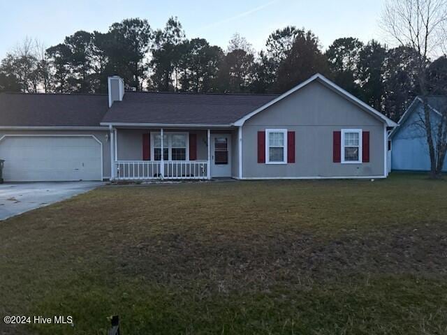 single story home with a front lawn, covered porch, and a garage