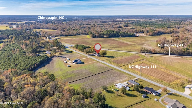 birds eye view of property featuring a rural view