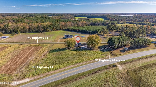 birds eye view of property featuring a rural view