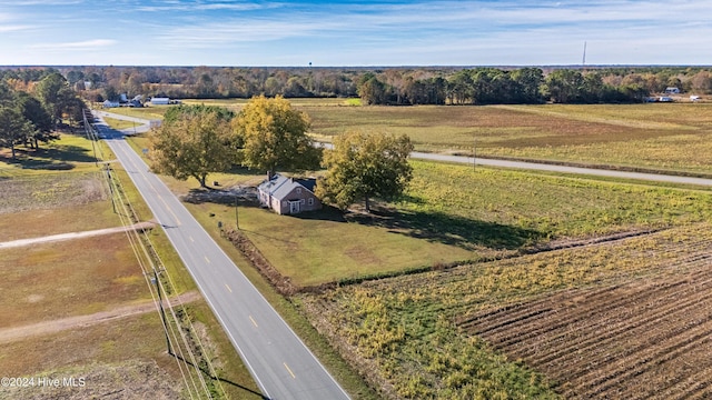 birds eye view of property with a rural view