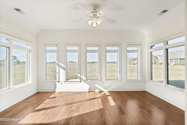 unfurnished sunroom featuring plenty of natural light and ceiling fan