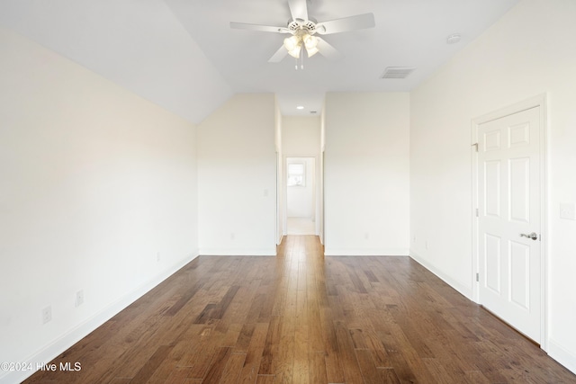 unfurnished room featuring lofted ceiling, ceiling fan, and dark hardwood / wood-style floors