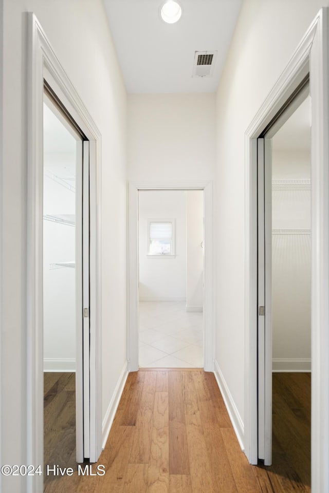 corridor featuring light hardwood / wood-style flooring